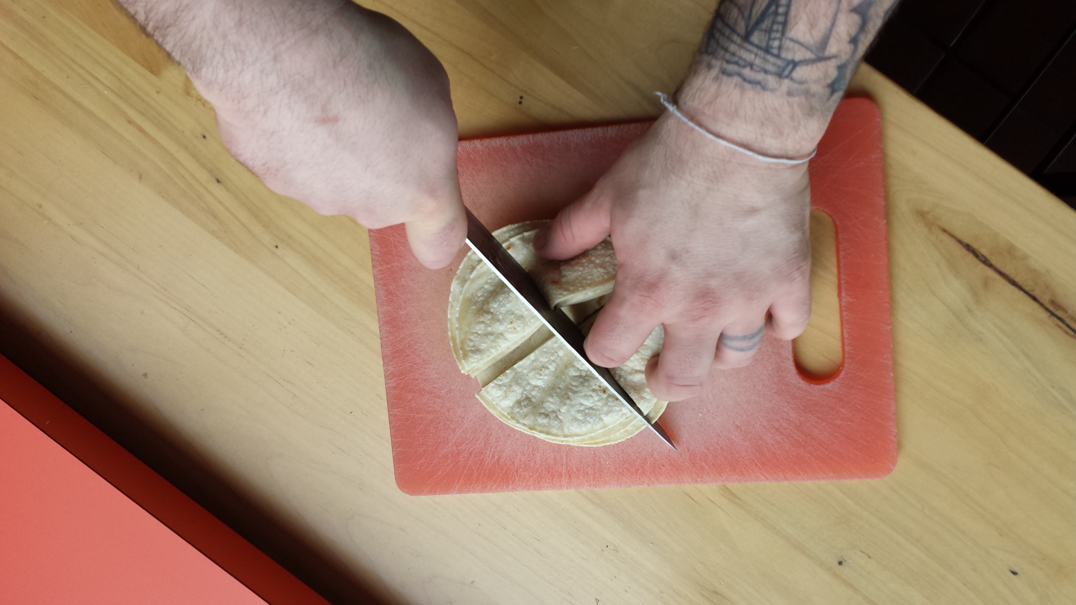 Nick slicing tortillas